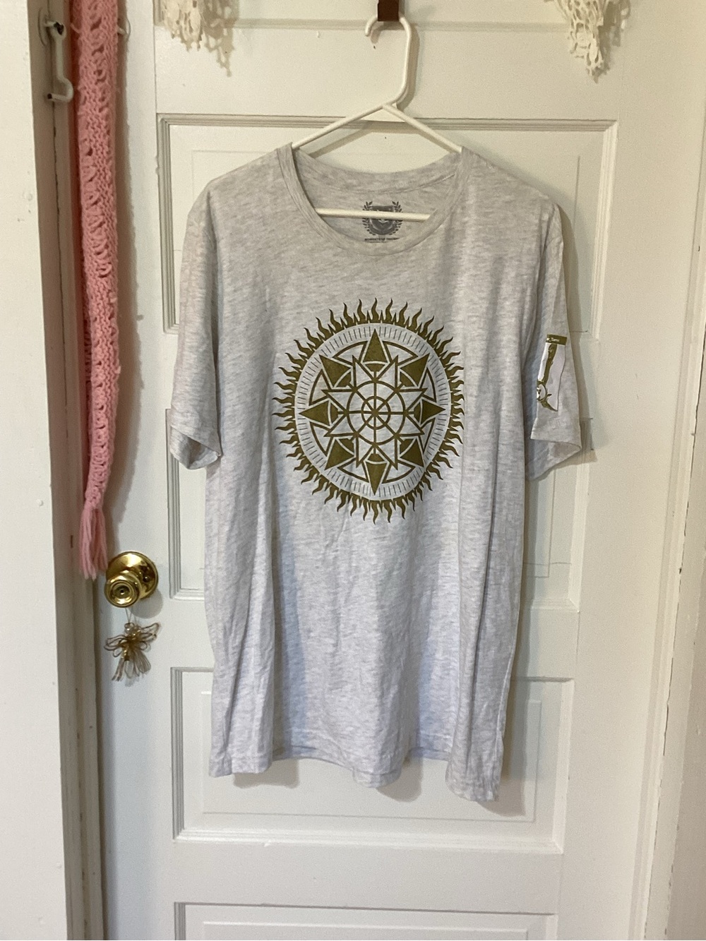 Moments of Triumph Solstice of Heroes Light Gray Tee with Olive Sun Mandala